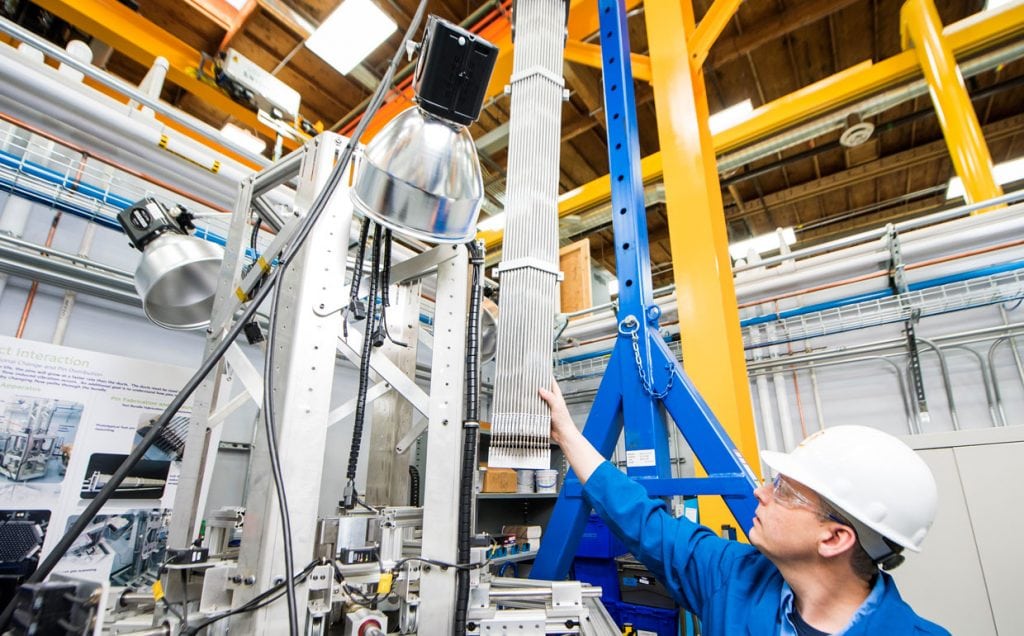 Foundational Underpinnings: An engineer readies a bundle of full-size mock fuel pins to test how they’ll perform during their operational lifetime.